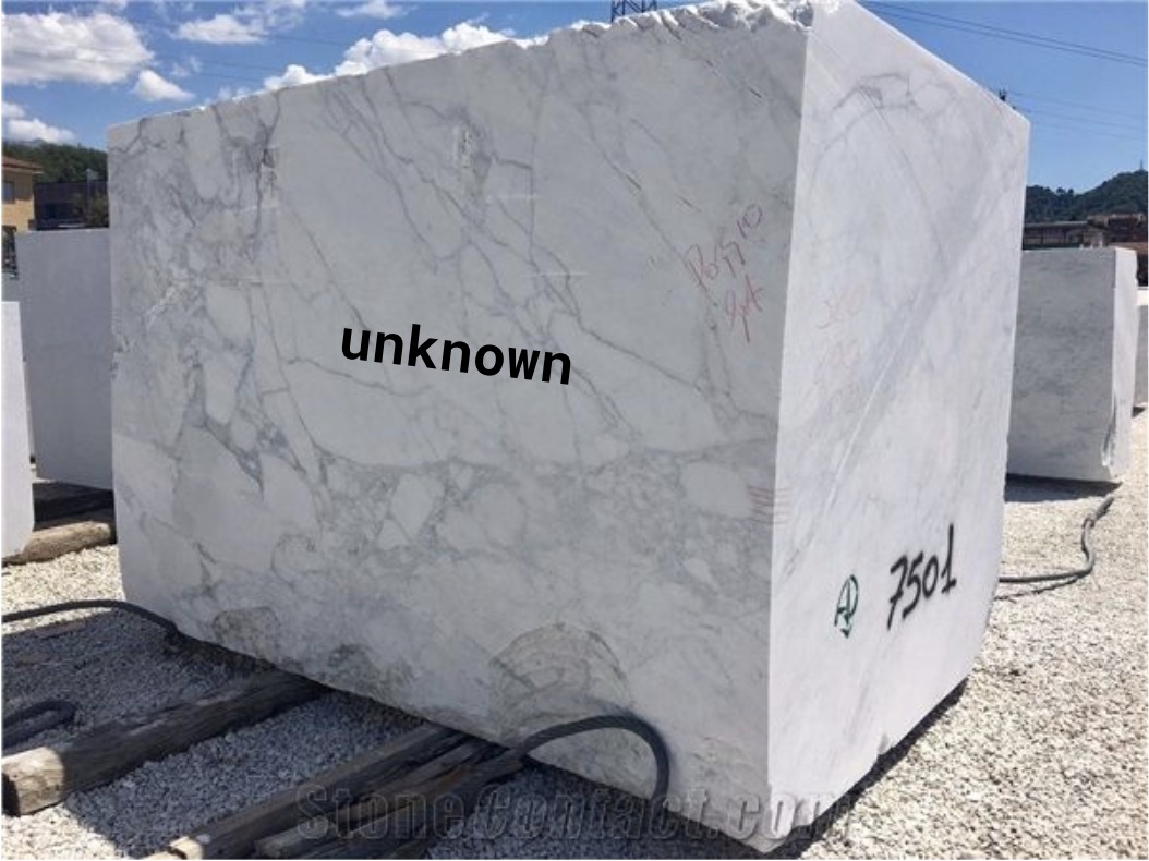 Large block of marble with the word unknown on it